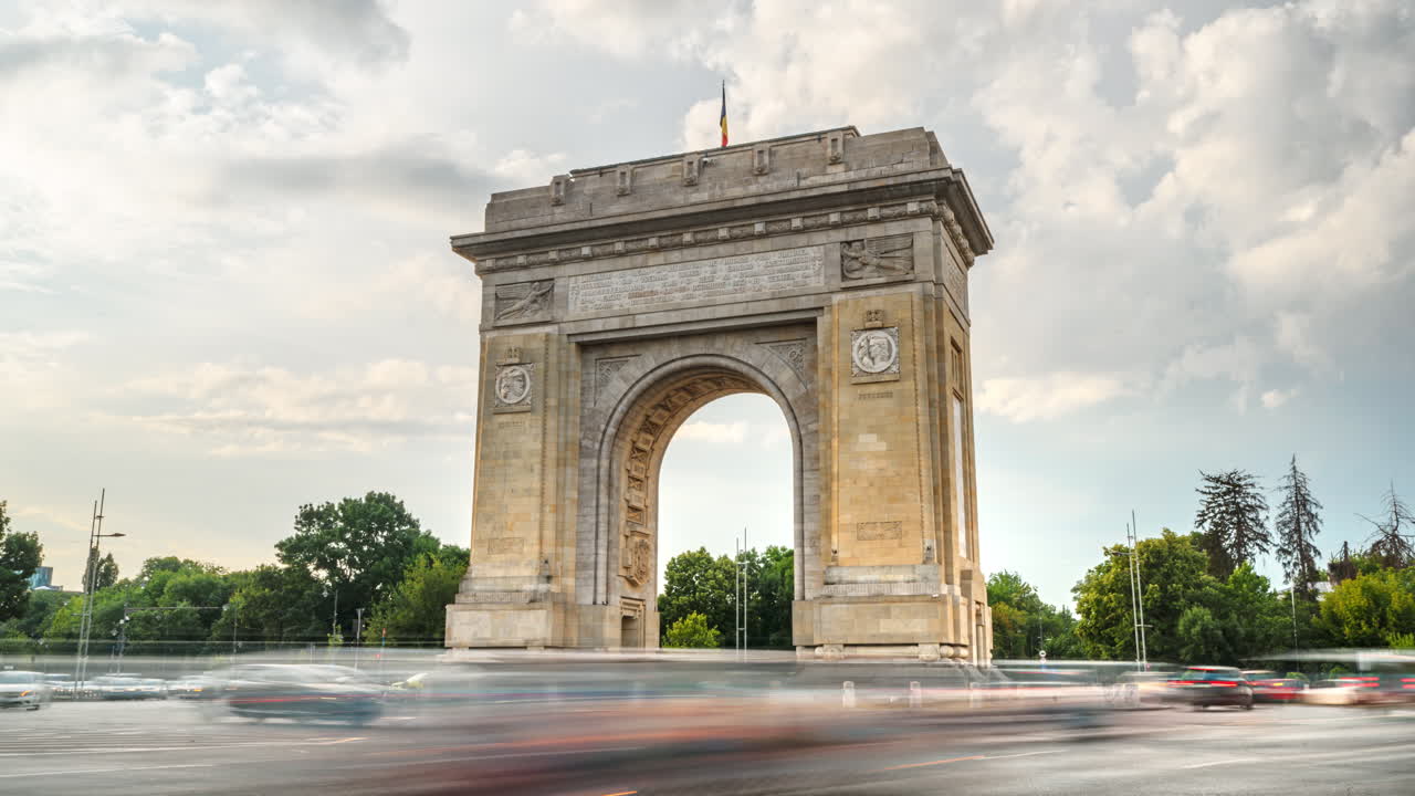 Time lapse of cars moving near the Triumphal Arch of Bucharest, Romania