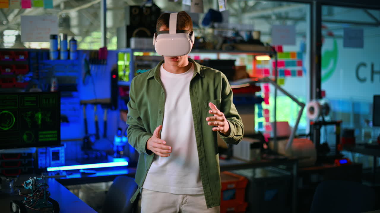 Portrait of a young man in VR glasses dancing like a robot