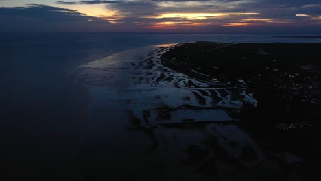 colorful aerial sunset to evening panning view of can gio, sea and sky, vietnam