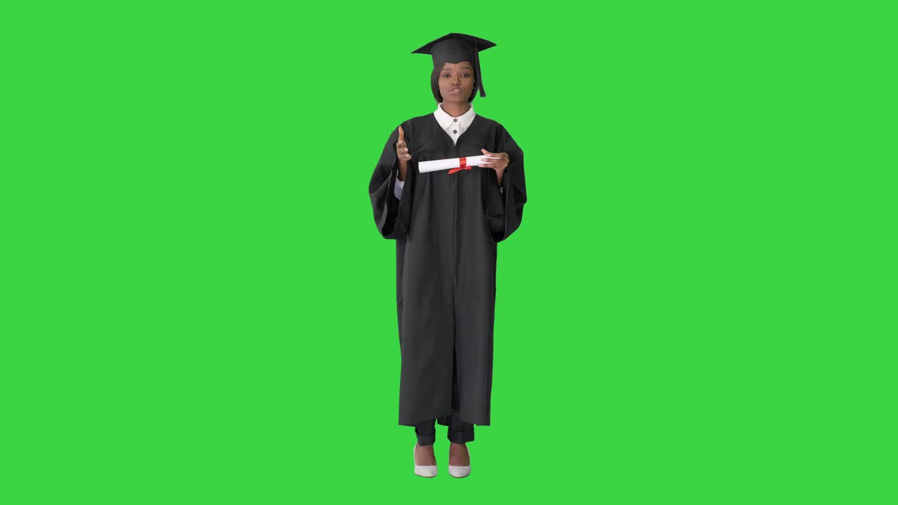 African American female graduate holding diploma and giving speech on a Green Screen, Chroma Key