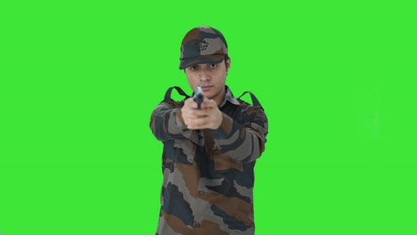 Indian-army-man-aiming-with-his-hand-gun-Green-screen