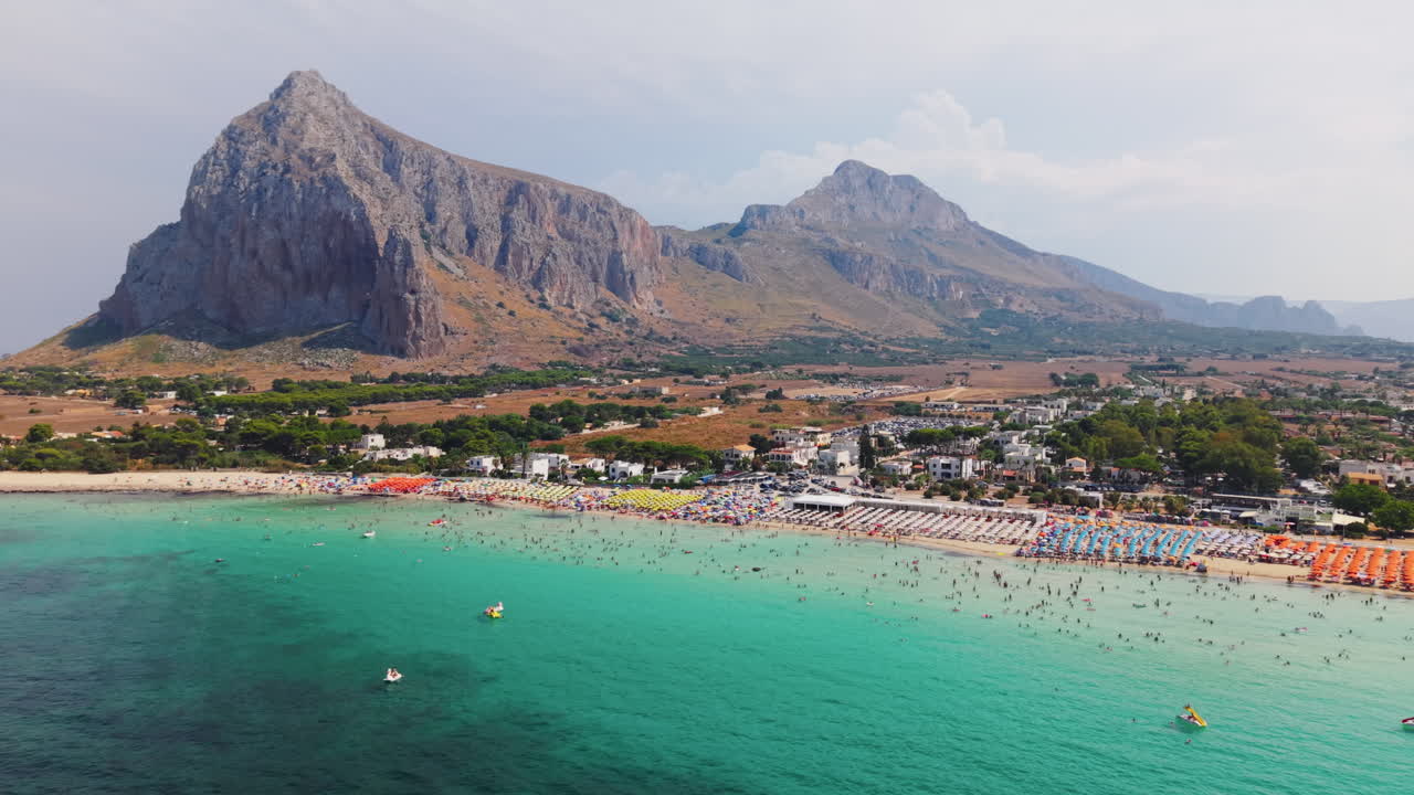 Beach resort with mountains in the background