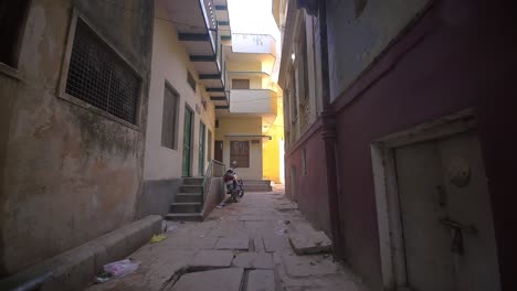 tracking shot through empty indian alleyway