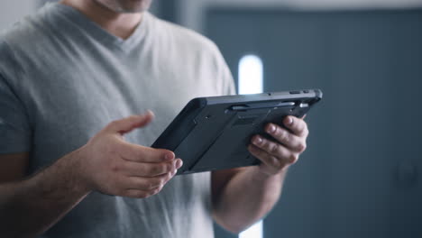man holding a tablet device