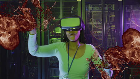 in server room, person wearing vr headset interacting with animation particles