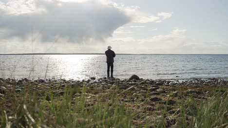 silhouette man fisher fishing throw rods trolling lake ocean fisherman hook salmon bait fiber glass meditation sea shore beach day off trawler catch lucky old alone relaxing summer food water clouds