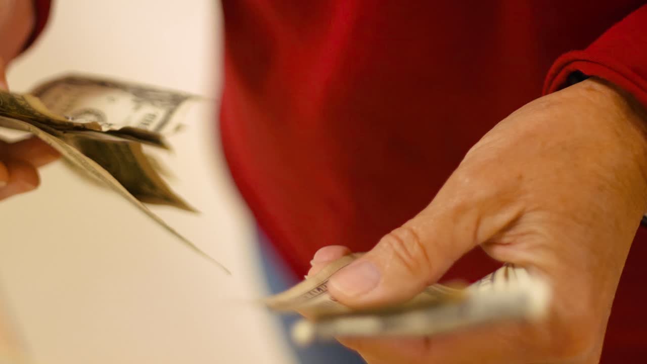 Close-up of Human hands counting American Money