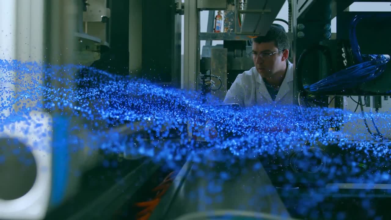 Animation of blue glowing mesh over male scientist with robot and tablet