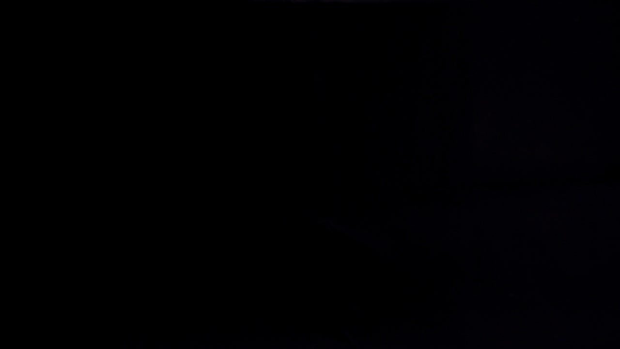 4K view of hands tearing up a dollar bill.