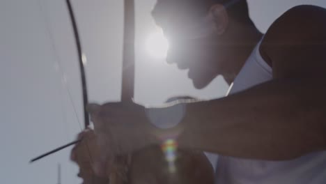 people playing the berimbau, a traditional brazilian instrument, outdoors