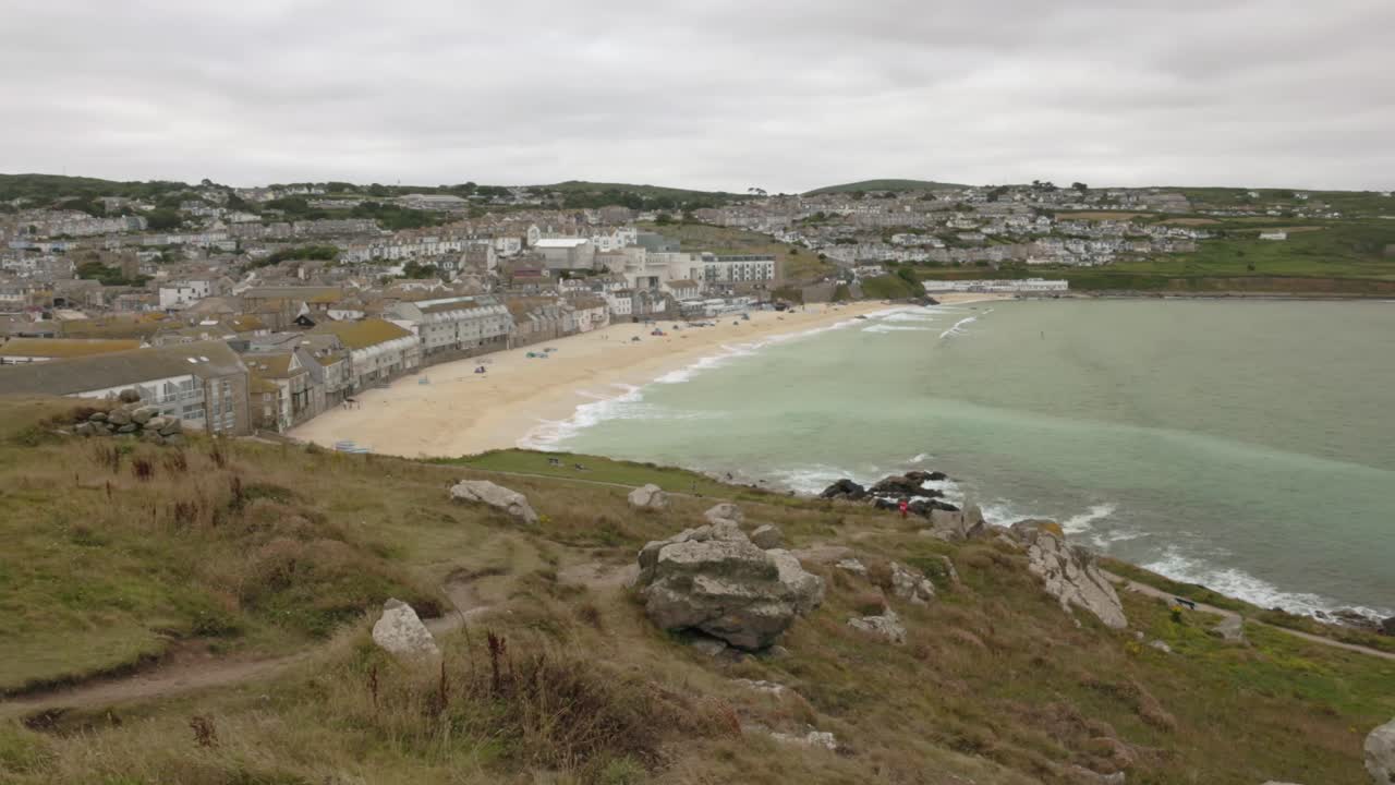 Panning shot of Porthmeor Beach during high tide from the Saint Nicholas Chapel viewpoint
