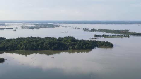 aerial view of large swathes of land under water in sylhet, bangladesh