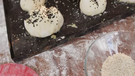 close up of rolls with poppy seeds in bakery kitchen in slow motion