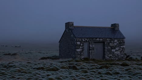 misty morning at an abandoned stone hut