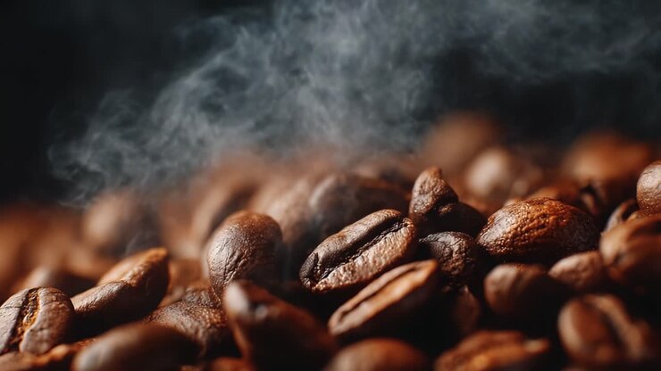 Aromatic Coffee Beans in Close-Up: Experience the Visual Delight of Freshly Roasted Beans with Their Rich Textures and Enveloping Aromas Rising Amidst Rising Steam