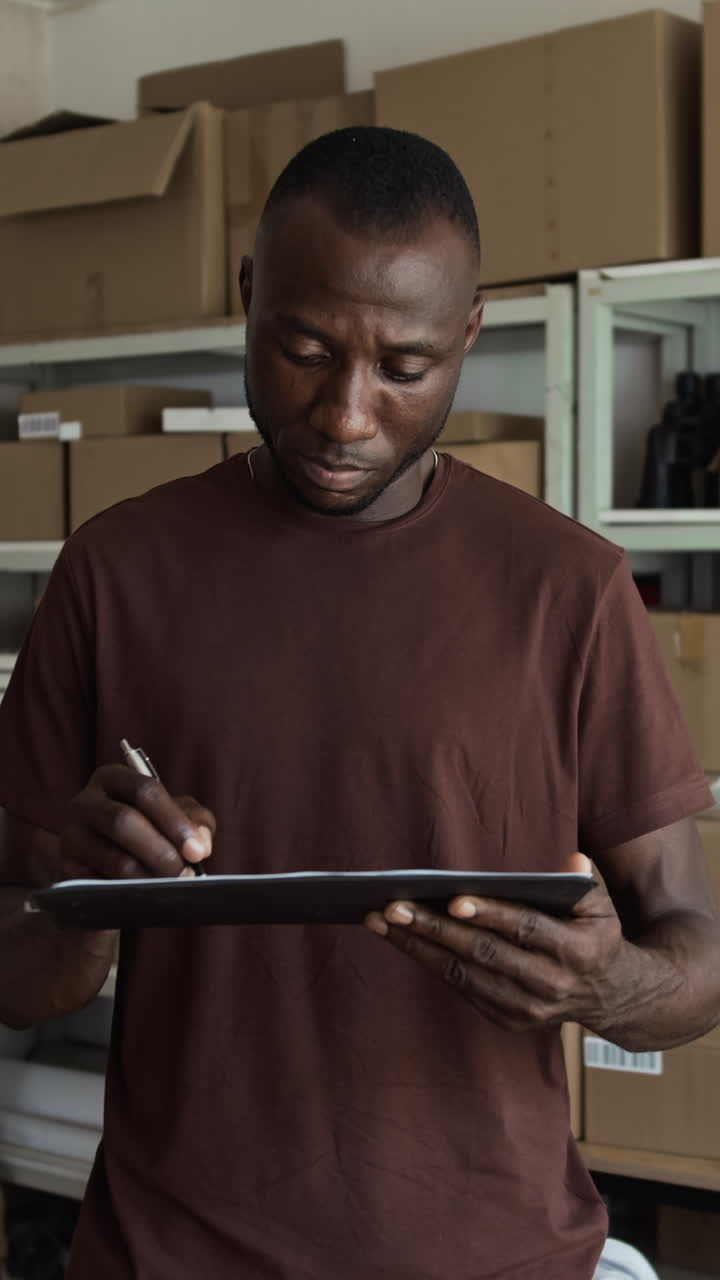 Black Male Storage Manager Filling Document