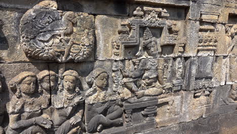 a dharma lesson illustrated in stone on the ancient buddhist temple of borobudur.