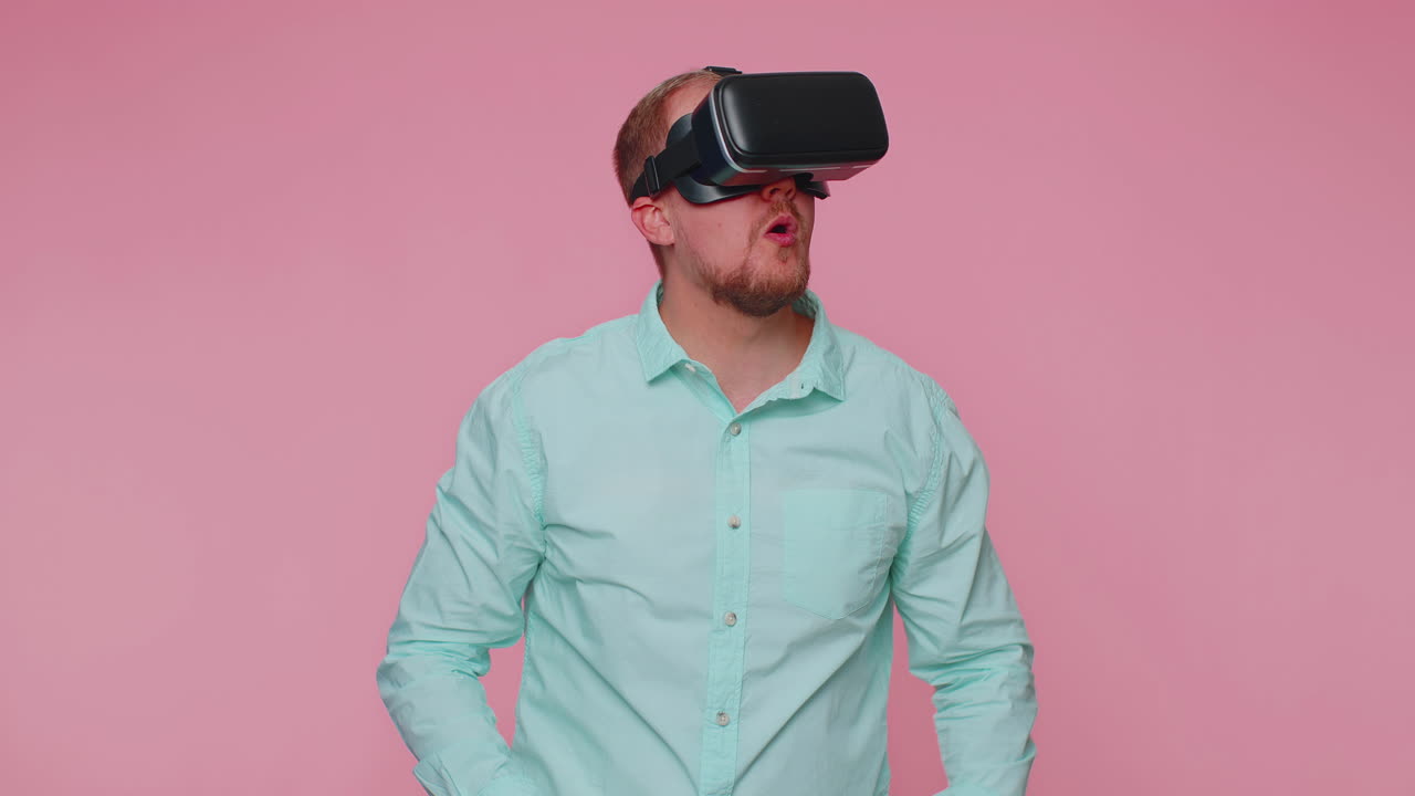 Man using virtual reality futuristic technology VR headset helmet to play simulation 3D video game