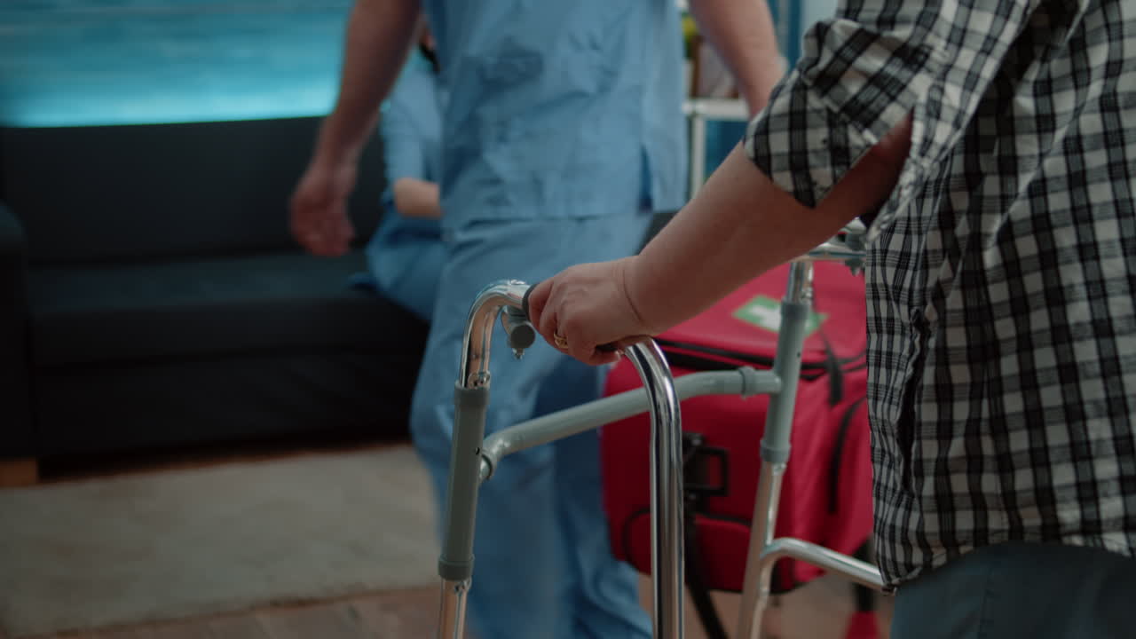 Close up of disabled patient having hand on walk frame