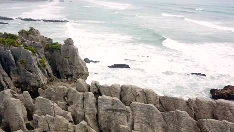 Drone-view-of-the-pancake-rocks-at-Dolomite-point,-Punakaiki,-New-Zealand