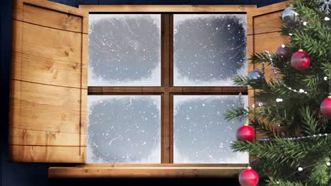 Christmas-tree-and-wooden-window-frame-against-snow-falling-over-winter-landscape