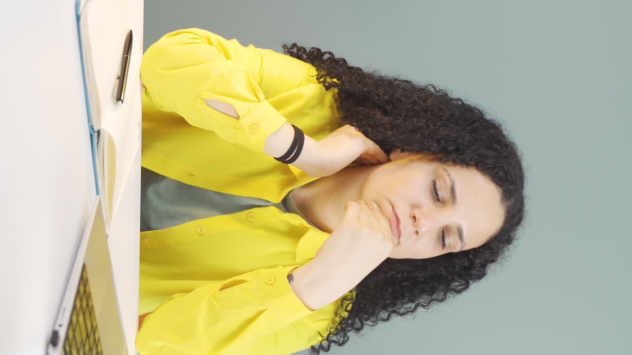 Vertical video of Confused young woman thinks and can't figure it out.