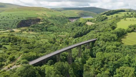 Aerial-view-of-Meldon-Viaduct,-Meldon-Reservoir,-and-Okement-Valley-in-Dartmoor-National-Park