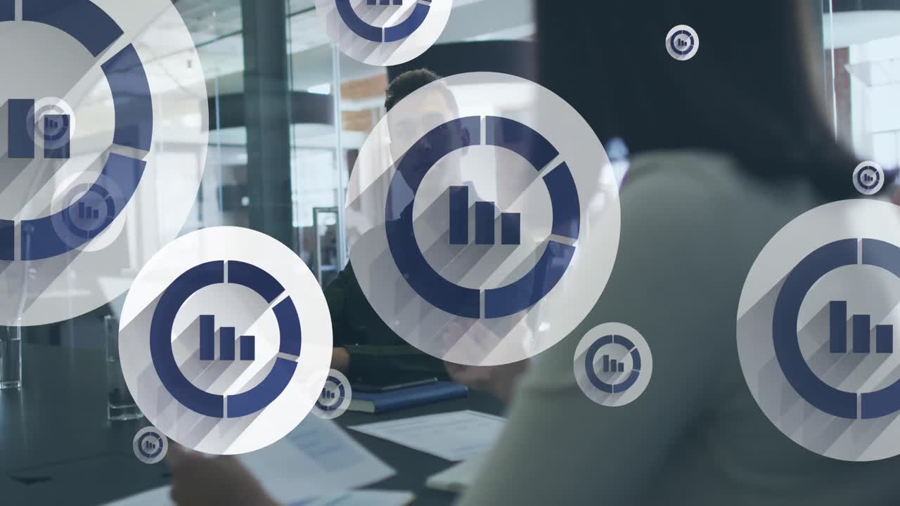 Animation of digital icons over diverse business people in office