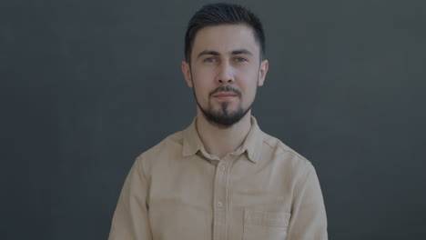 man in beige shirt