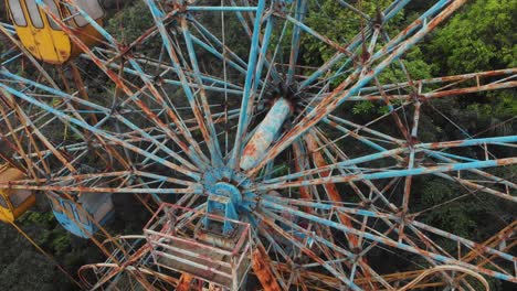 close up shot of old abandoned ferris wheel at hanoi vietnam, aerial