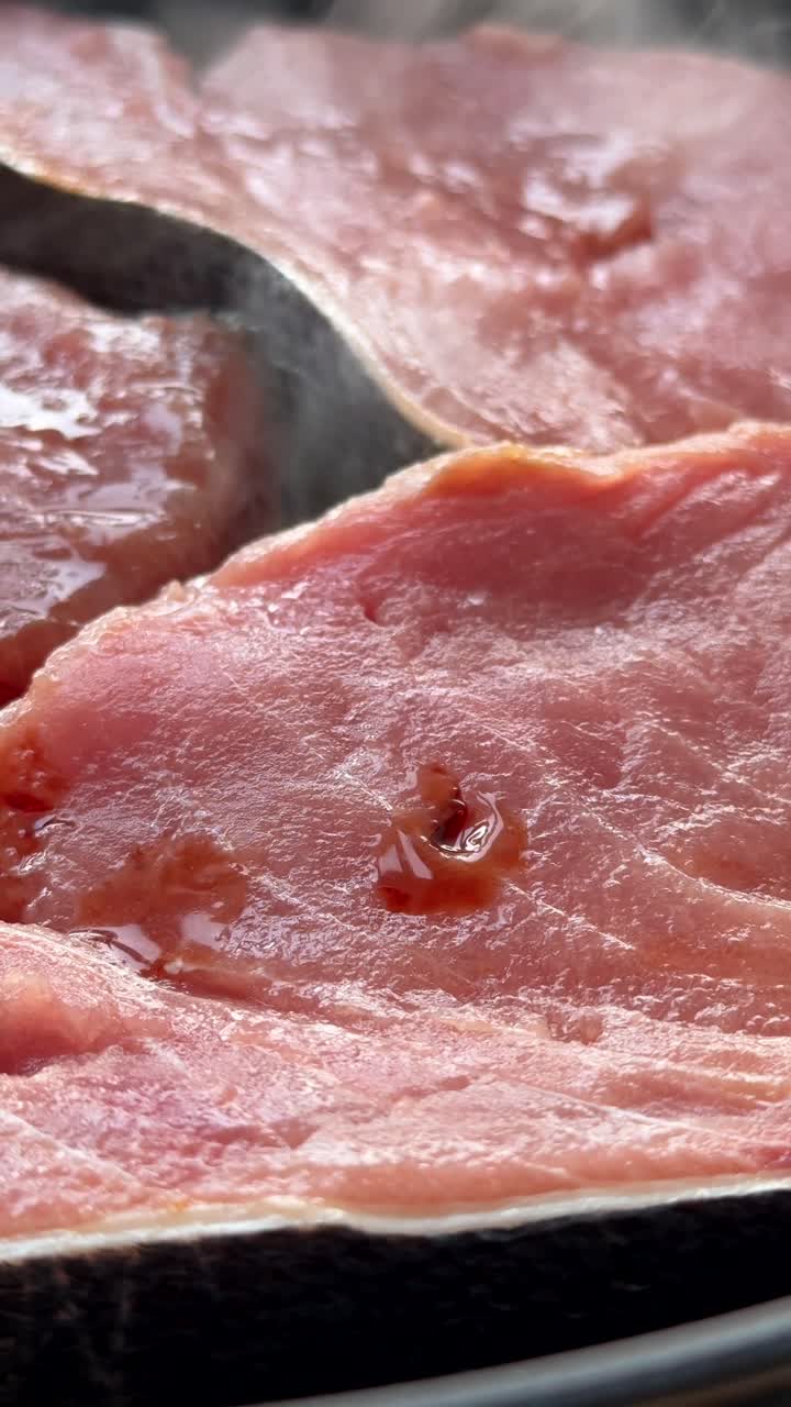 Close-up of Raw Fish Fillets Being Prepared