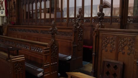 old wooden church pews along the interior of european cathedral in inverness, scotland in the highlands