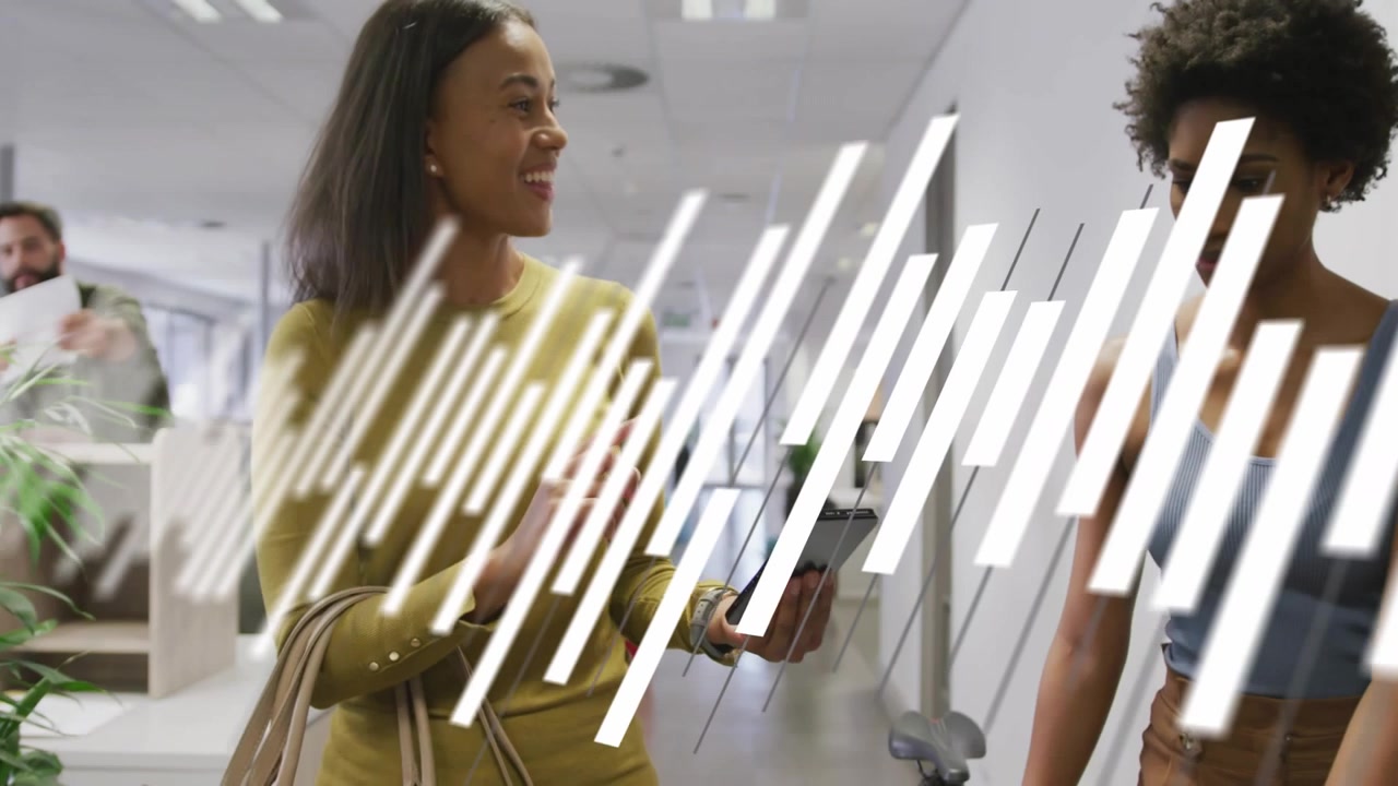 Vertical video: Holding phone, mustard-top woman tapping and showing to coworker in office, overlay