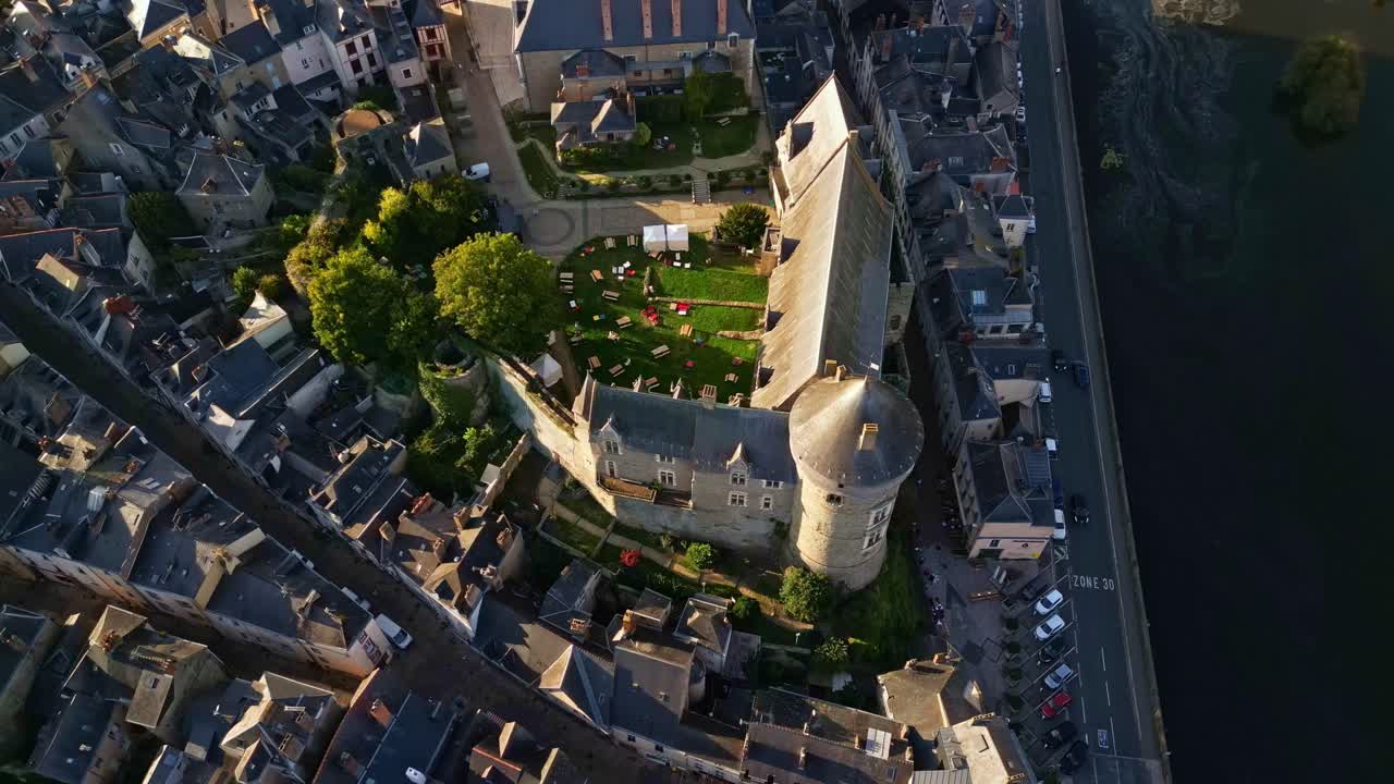 Flyover of Chateau de Laval from high angle revealing full structure and city around it, panoramic aerial overview