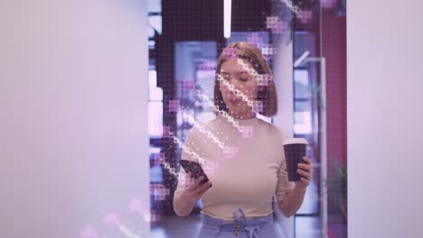 animation of dna strand spinning over asian businesswoman using smartphone in office