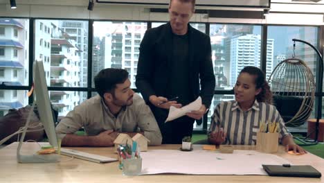 creative business people group having conversation at office desk in workplace.