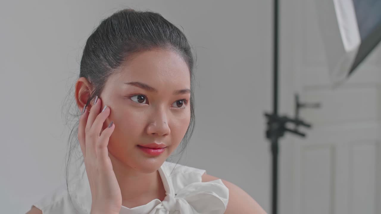Behind The Scenes On Photo Shoot: Beautiful Asian Model Poses For A Photographer