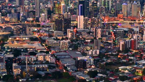 cityscape illuminated with lights in toowong, brisbane, queensland, australia - aerial drone shot