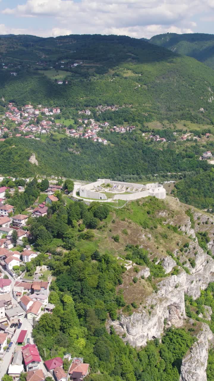 Aerial view of the White Fortress, a historical landmark overlooking Sarajevo, nestled in the picturesque valley of Bosnia and Herzegovina. Vertical Video