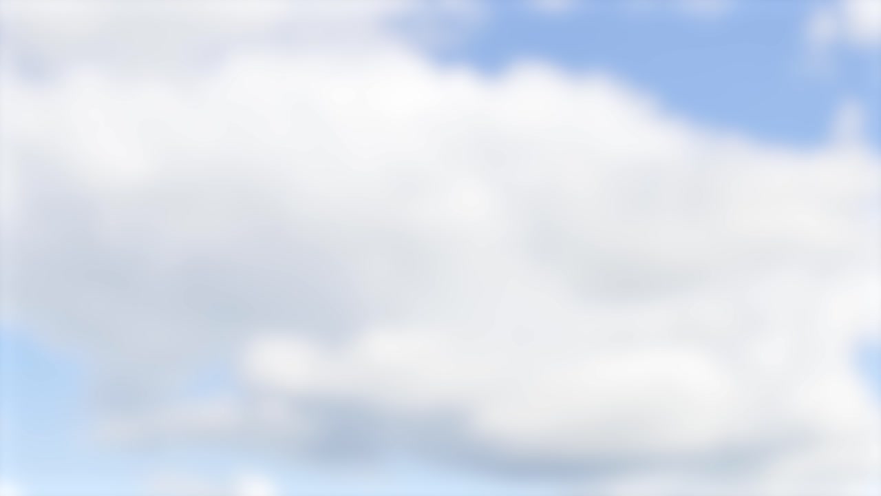 A serene video of fluffy clouds drifting across a bright blue sky, creating a peaceful and calming atmosphere