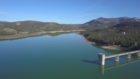 aerial view of a big reservoir with a control tower in the south of spain