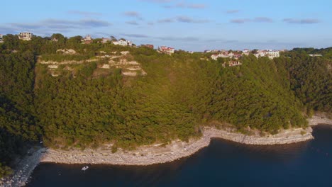 High-slow-pan-of-the-cliffs-on-Lake-Travis