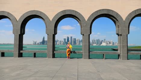 woman at doha skyline