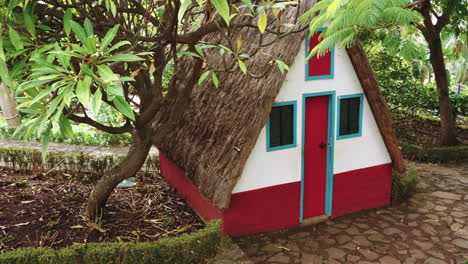 charming traditional straw roof hut in a tropical garden