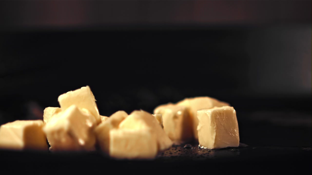 Slow Motion Butter Cubes Melting on a Hot Surface