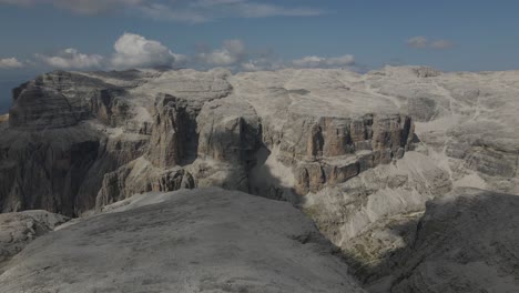 Dolomites-aerial-view,-top-of-a-tall-mountain-awesome-secluded-landscape,-Italy