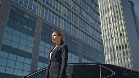 posh businesswoman posing downtown sunny morning. elegant woman manager standing