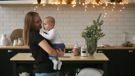 Mother-and-Baby-slow-motion.-Happy-Family.-Mom-With-her-Child-smiling-and-laughing-at-home.