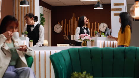 hotel guest asking staff about amenities at holiday retreat