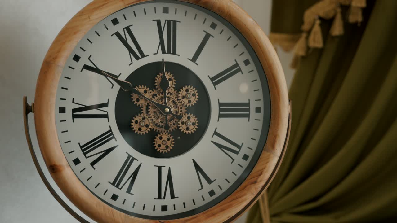 Round Clock With Wooden Frame, Roman Numerals, And Visible Moving Gears At The Center. closeup shot